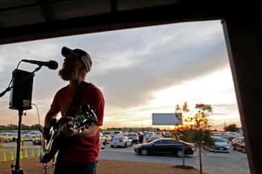 Joshua Irwin of Fort Worth entertains the crowd on the covered patio with some live music...