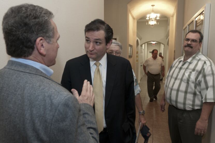 Before a Tea Party Forum in Talty on Thursday, Ted Cruz (center) talked with John Cook....