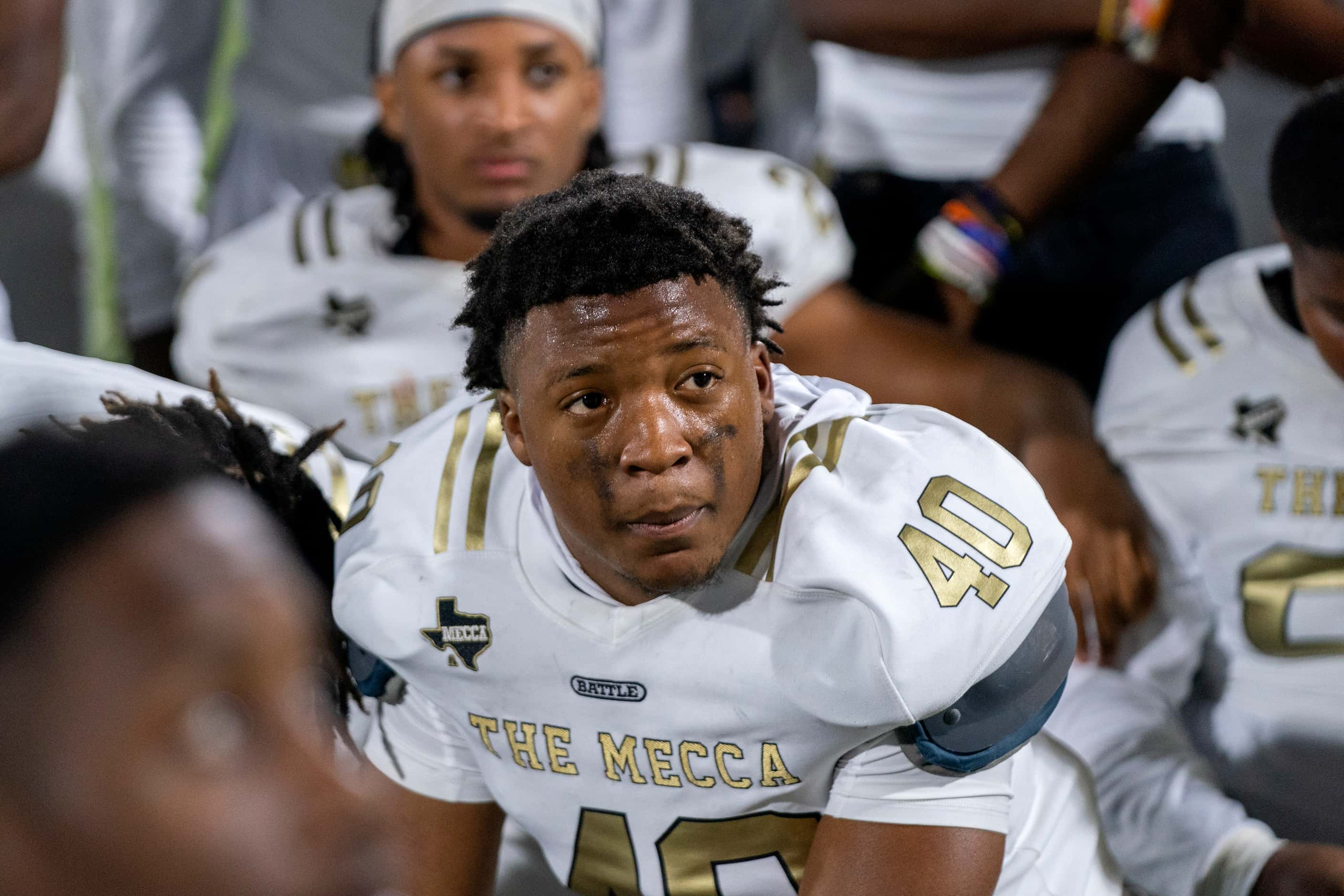 South Oak Cliff senior defensive lineman Robert Strahan (40) listens to his coach after a...