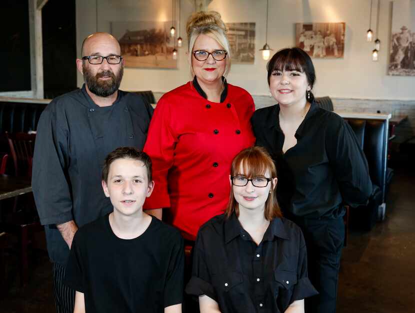 Owner and Executive Chef Phil Doyal, back row left, his wife owner and Pastry Chef Christina...