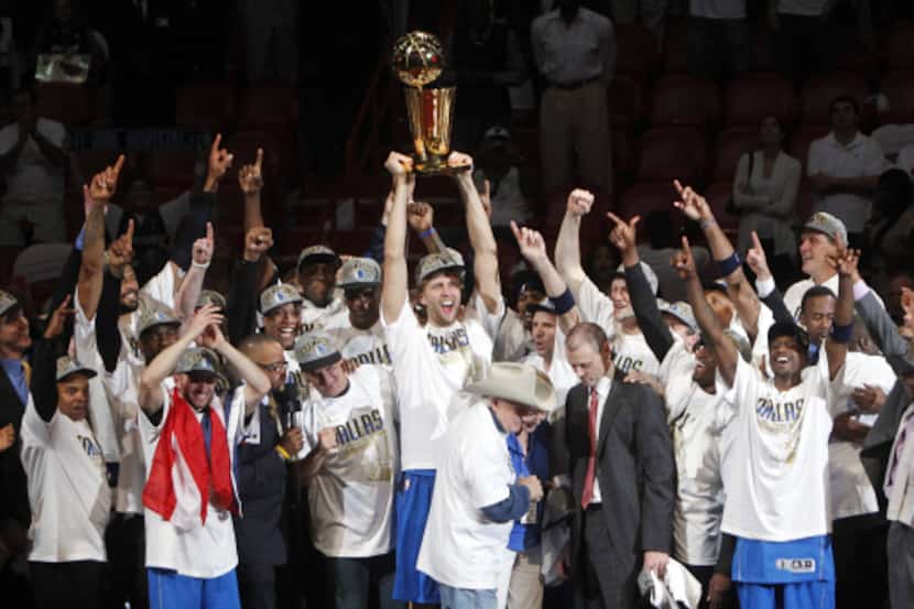 Dirk Nowitzki and the Dallas Mavericks celebrate their first NBA championship on June 12,...