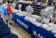 Billy Anderson of Dallas shops Dallas Mavericks NBA Finals shirts at an Academy Sports &...