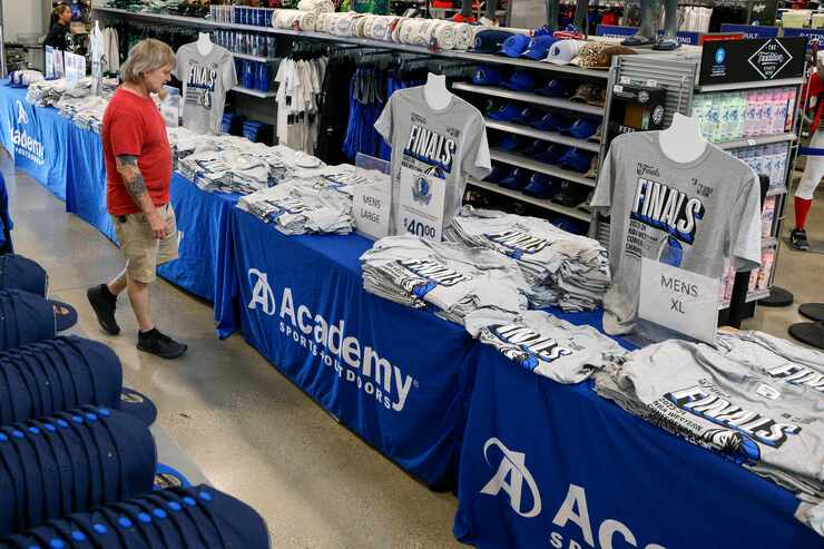 Billy Anderson of Dallas shops Dallas Mavericks NBA Finals shirts at an Academy Sports &...