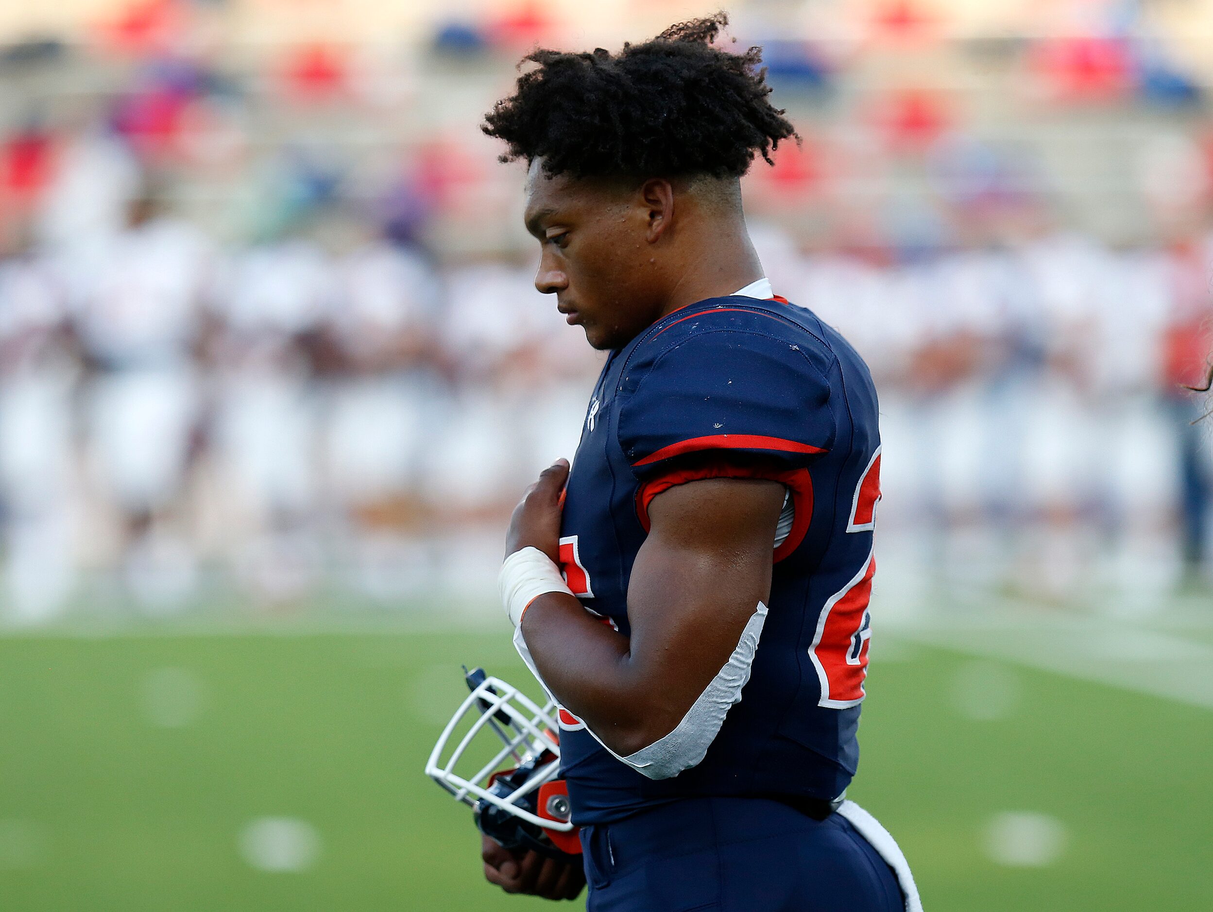 McKinney North High School running back Jadan Smith (25) during the national anthem before...