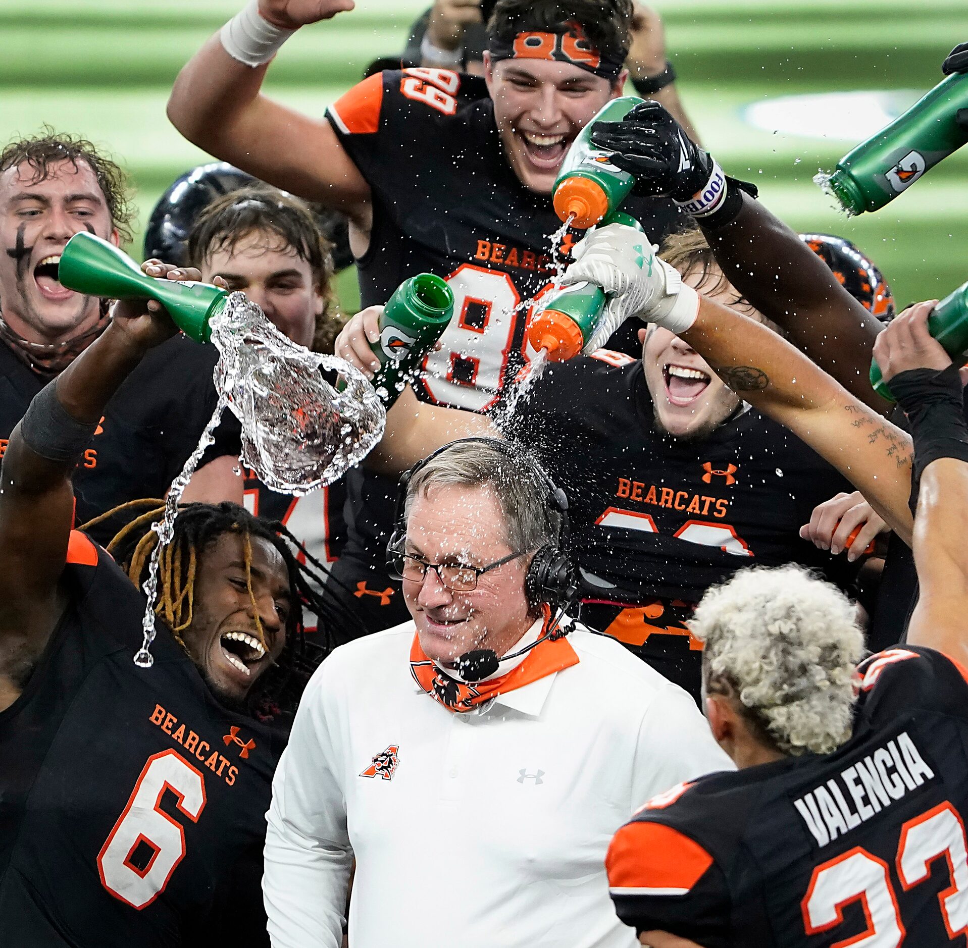 Aledo running back DeMarco Roberts (6), the offensive MVP of the game, leads the charge as...