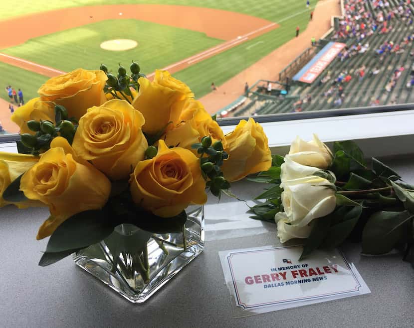 Flowers are seen in sports reporter, Gerry Fraley, of The Dallas Morning News spot in the...