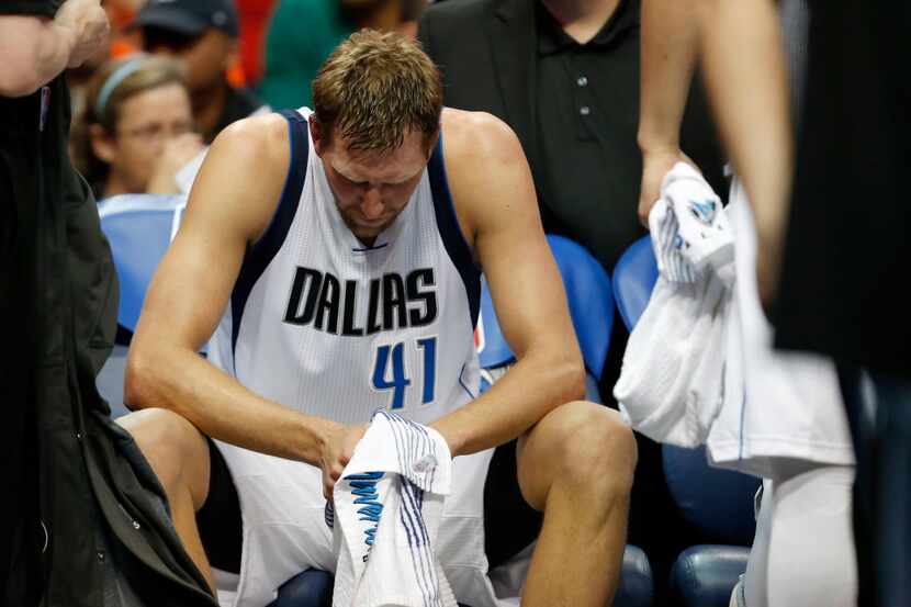 Dallas Mavericks forward Dirk Nowitzki (41) on the bench after a timeout during the second...