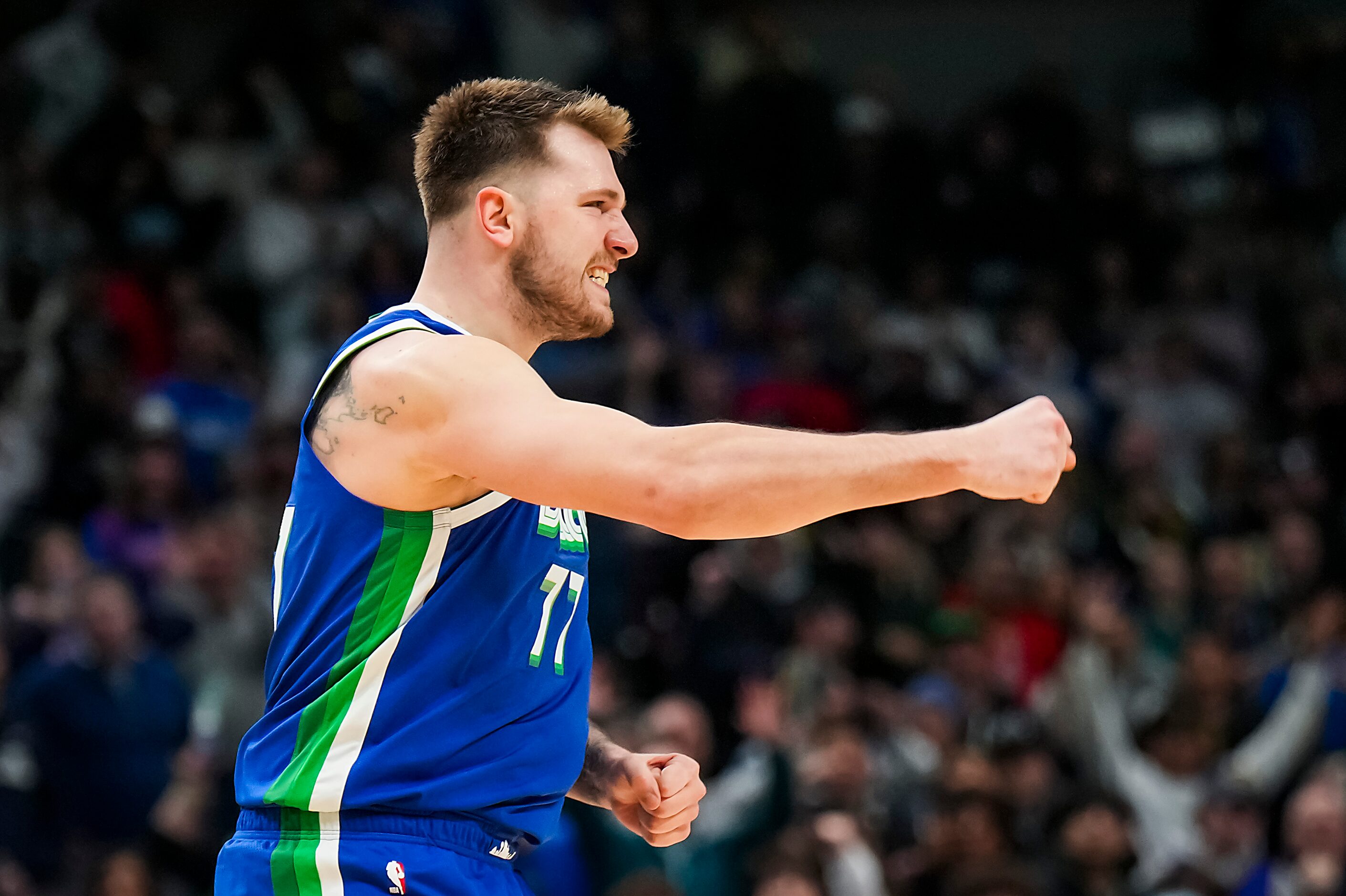 Dallas Mavericks guard Luka Doncic (77) celebrates after hitting a basket during the second...