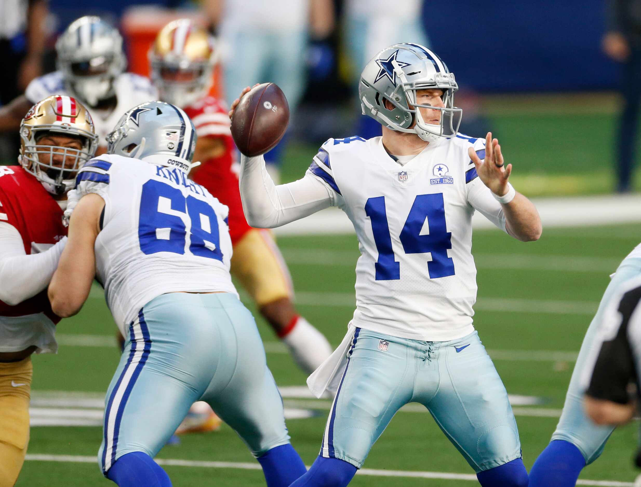 Dallas Cowboys quarterback Andy Dalton (14) attempts a pass in a game against the San...