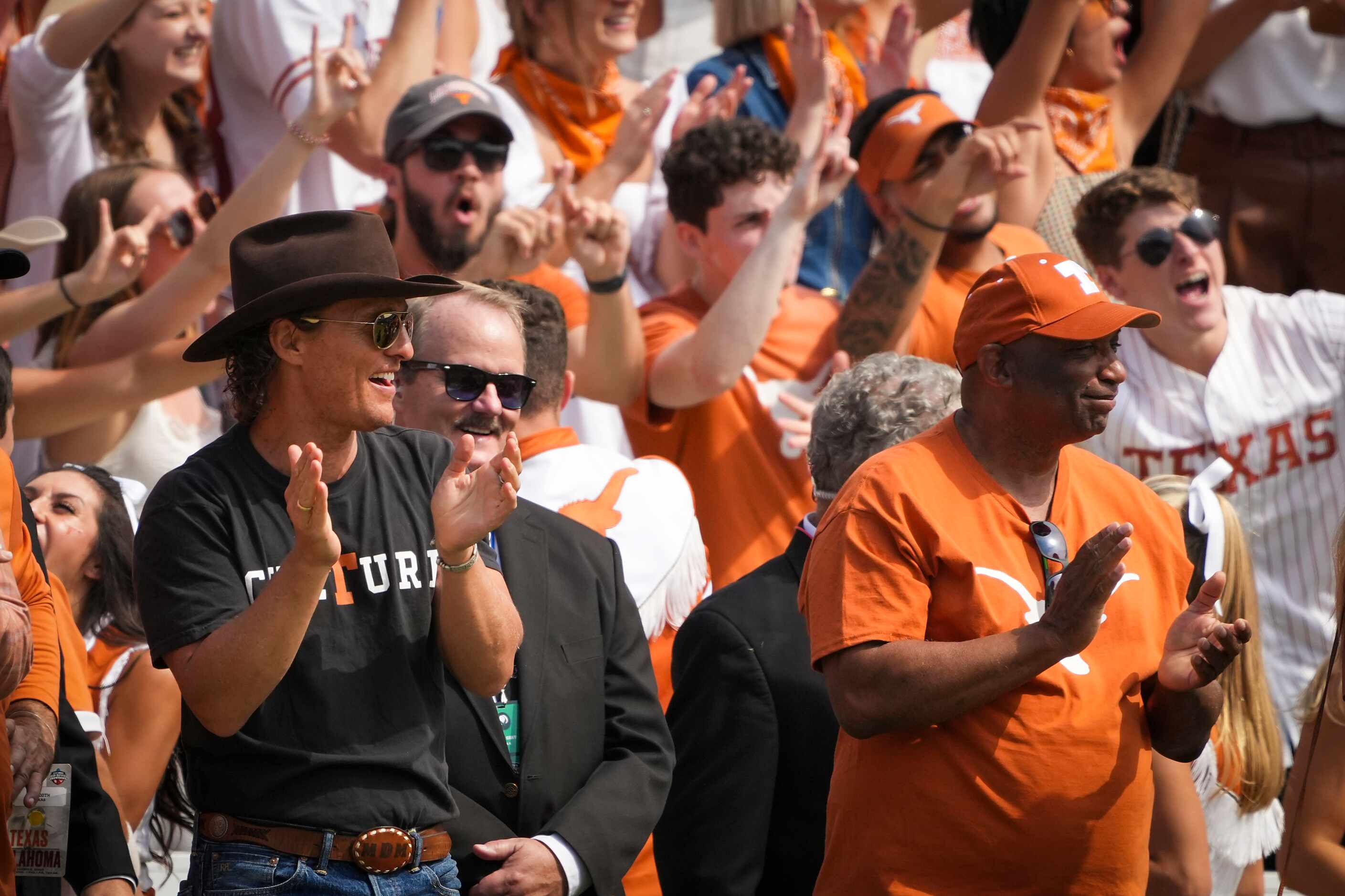 Actor Matthew McConaughey cheers a Longhorns play during the first half of the annual Red...