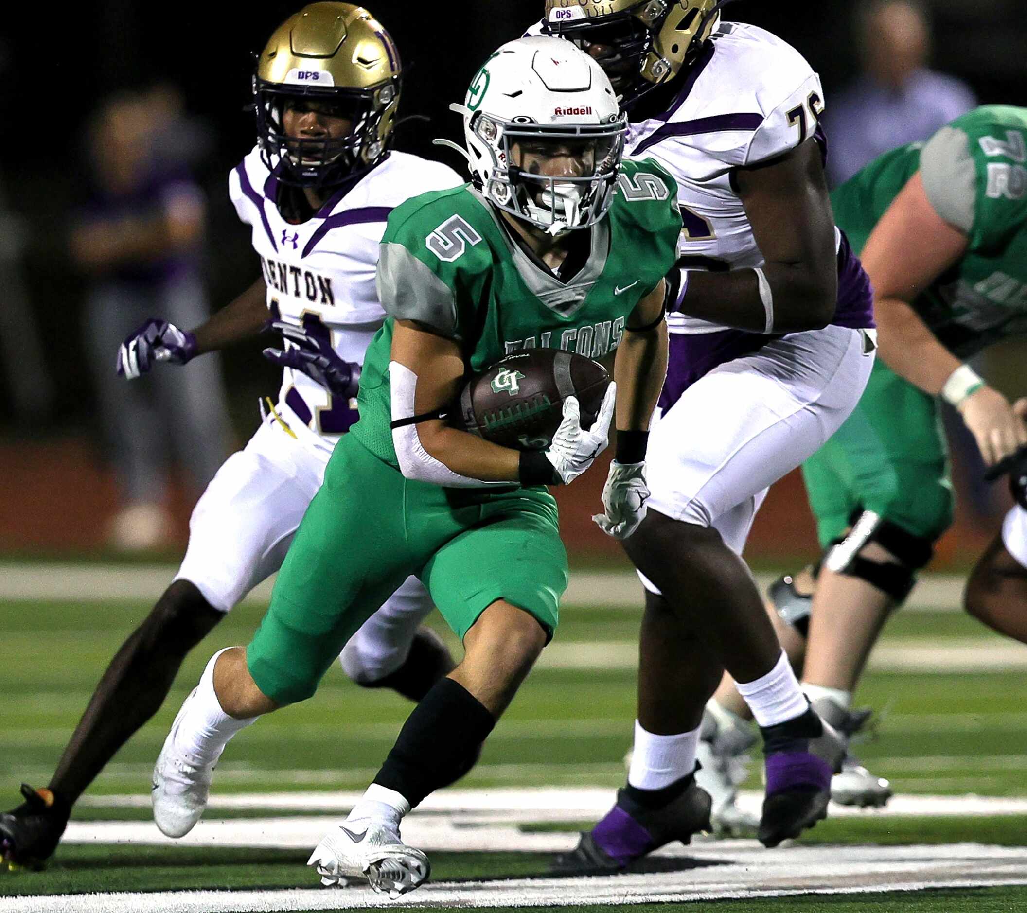 Lake Dallas running back Sam McAfee (5) finds a nice hole to run against Denton during the...