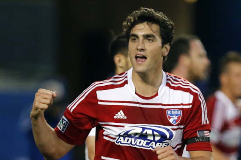 FC Dallas' George John (14) celebrates scoring the game's first goal against Vancouver...