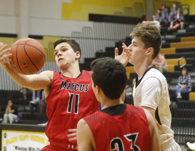 Flower Mound Marcus Jake Watermiller, #11, grabs loose ball against Plano East in District...