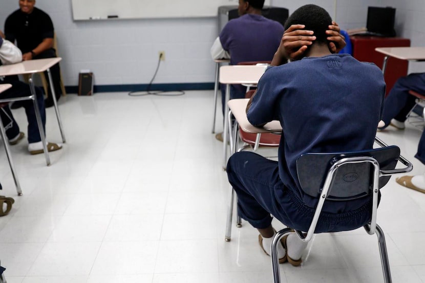 
A youth attends a math class at the justice center. (Rose Baca/Staff Photographer)