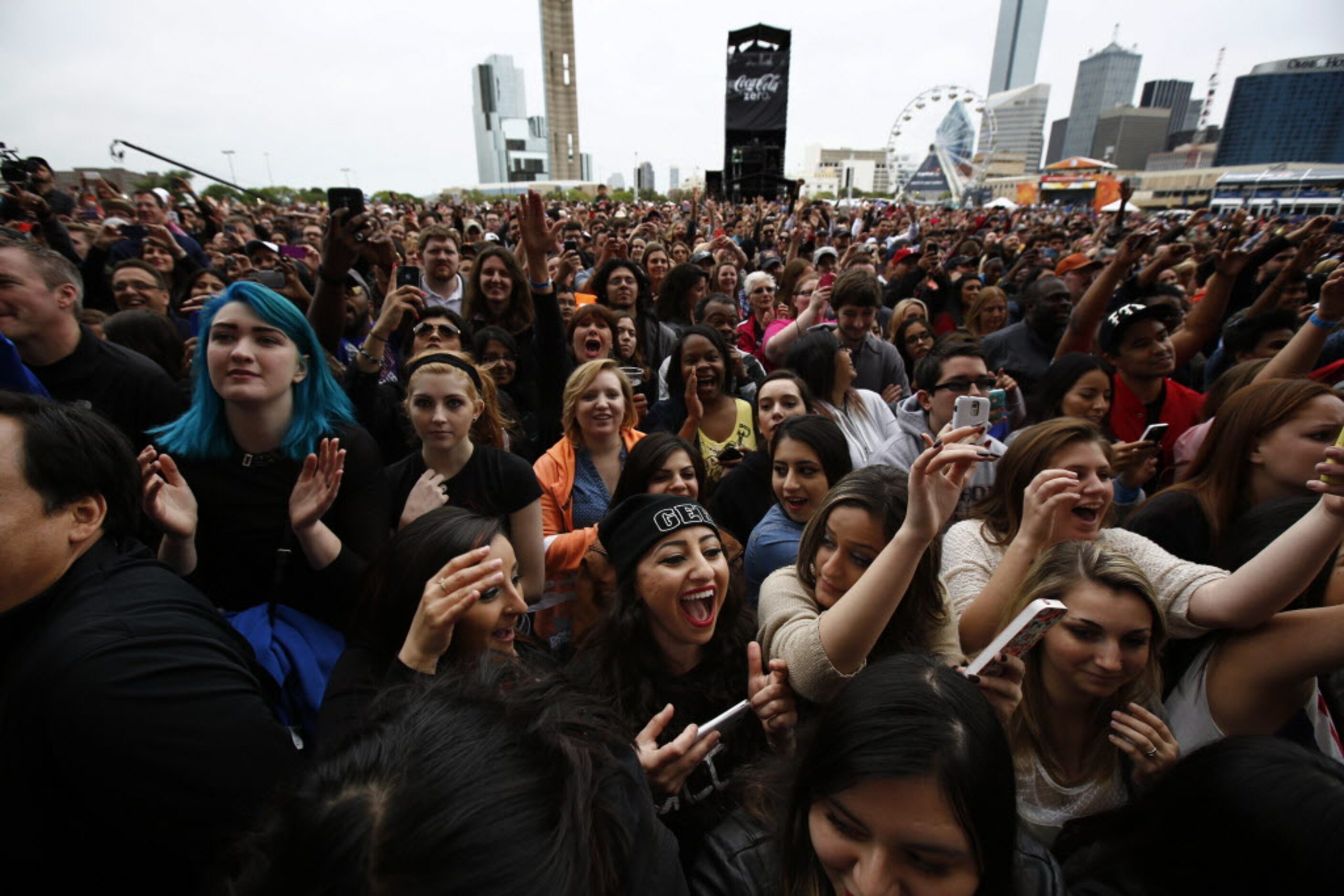 Fans scream for LL Cool J to perform during the March Madness Music Festival at Reunion Park...