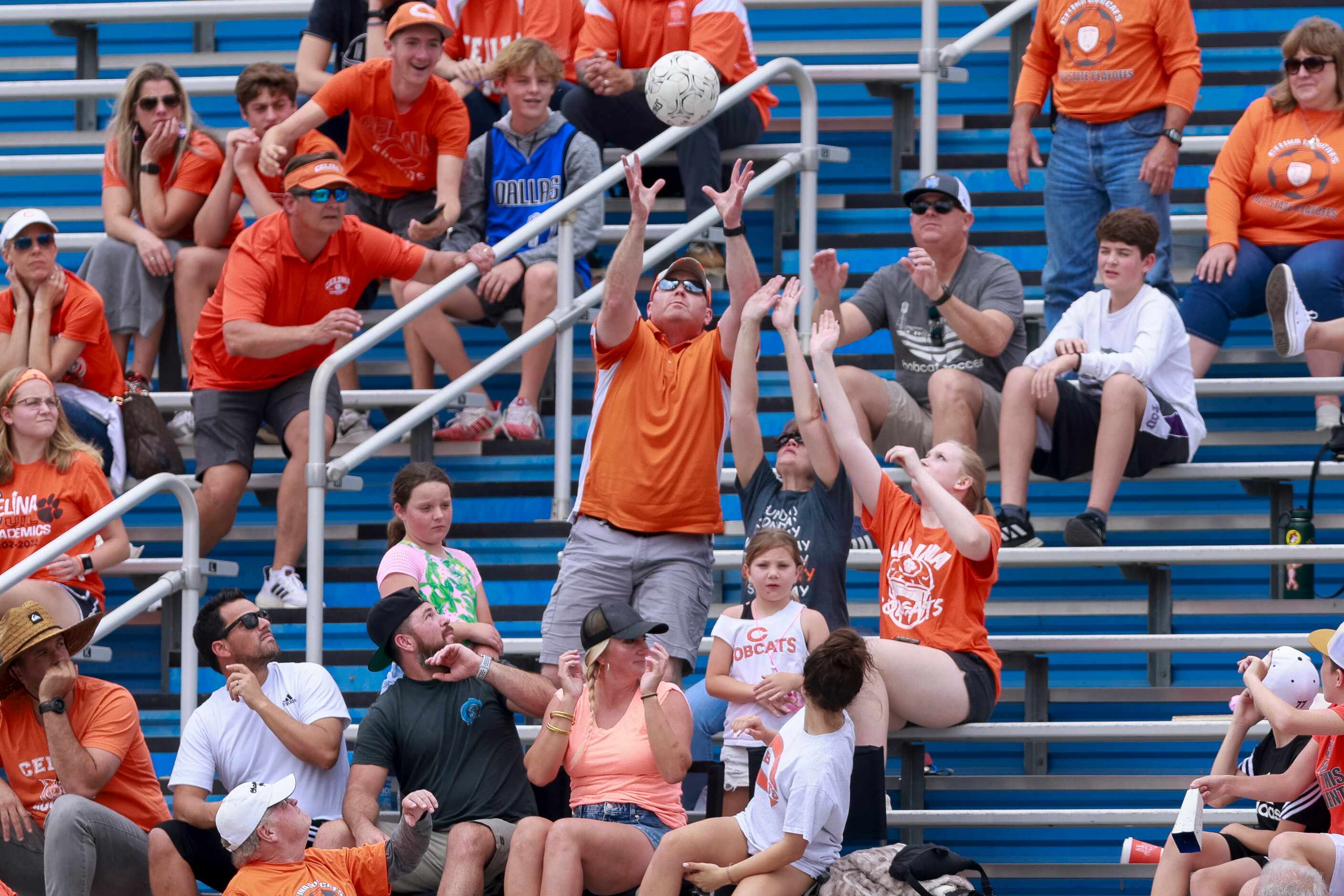 A Celina fan catches the ball after it was kicked out of bounds during the first half of the...