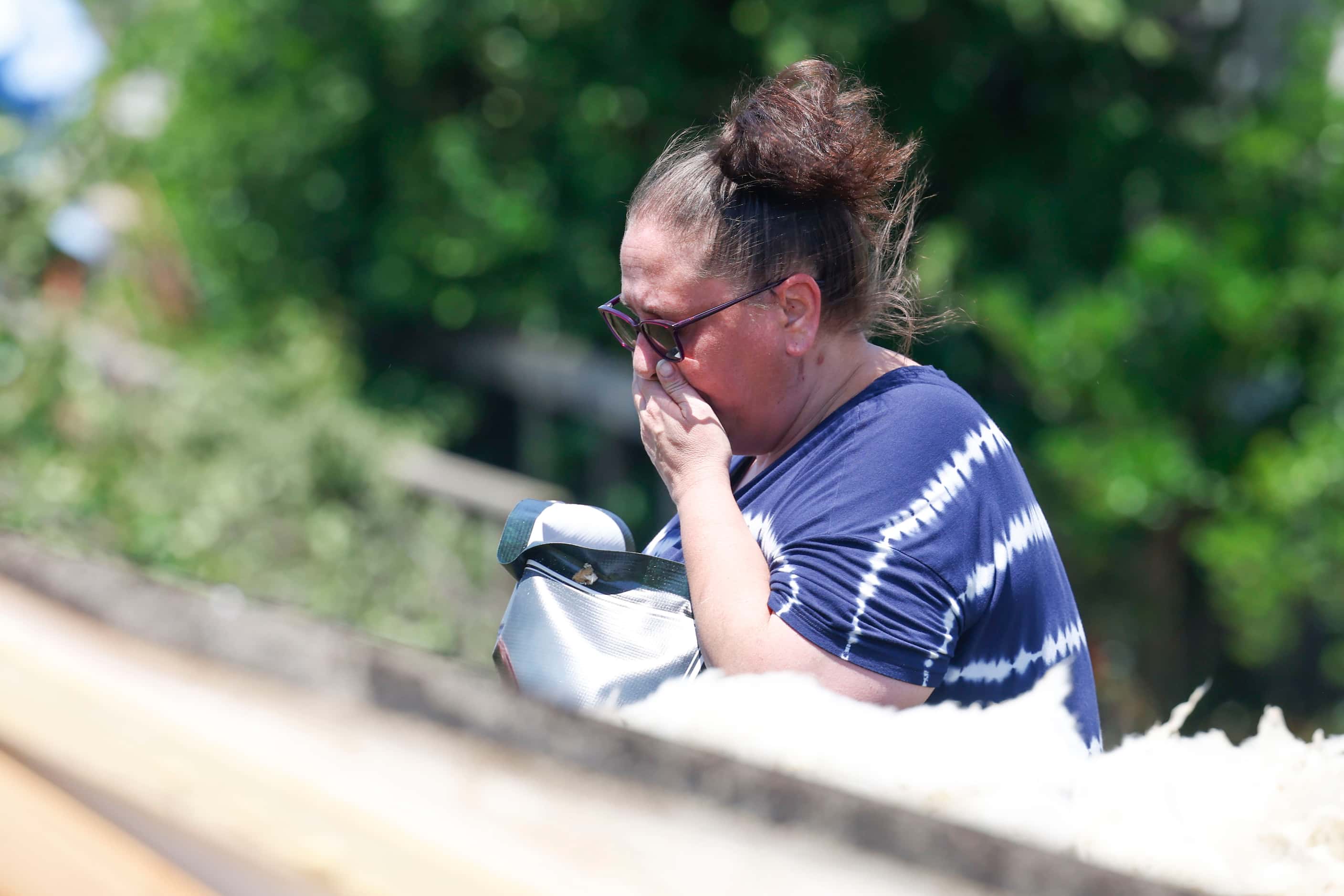 Amber Lidster, 44, resident of Valley View for 40 years, gets emotional as she goes around...
