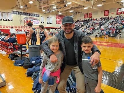 Paul Allen with daughter Everly and son Luke at a Lake Highlands High School basketball game...