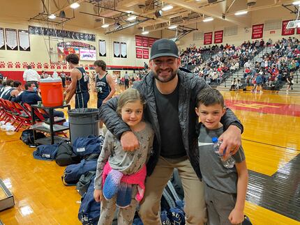 Paul Allen with daughter Everly and son Luke at a Lake Highlands High School basketball game...