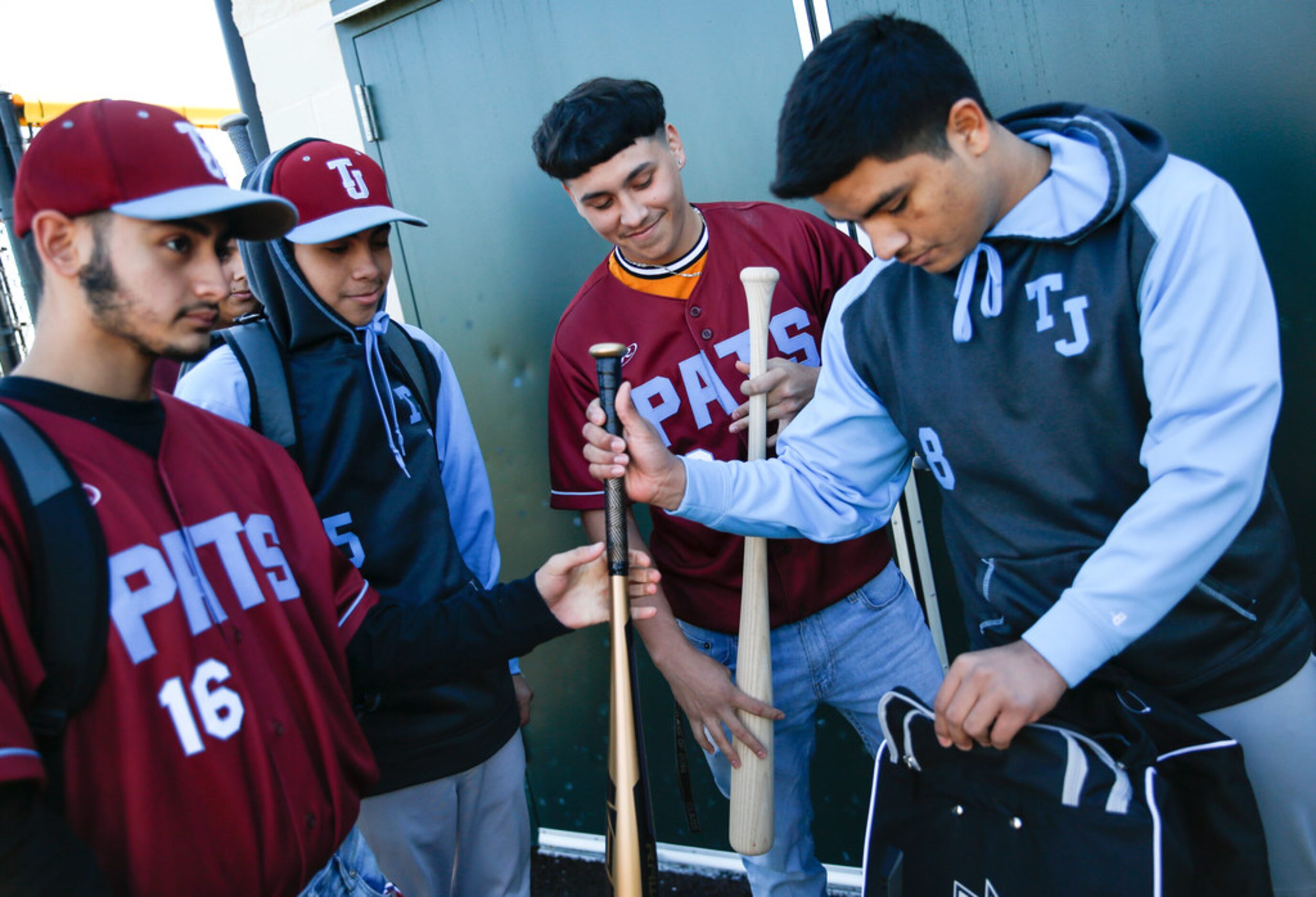 Thomas Jefferson High School baseball players react after receiving a donation from Rangers...