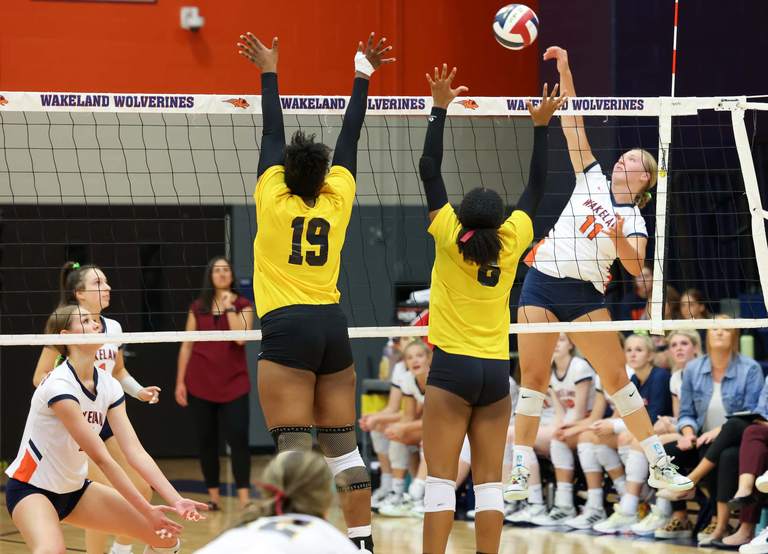 Frisco ISD’s Wakeland High School volleyball player Keala Bandy (11) spikes the ball over...
