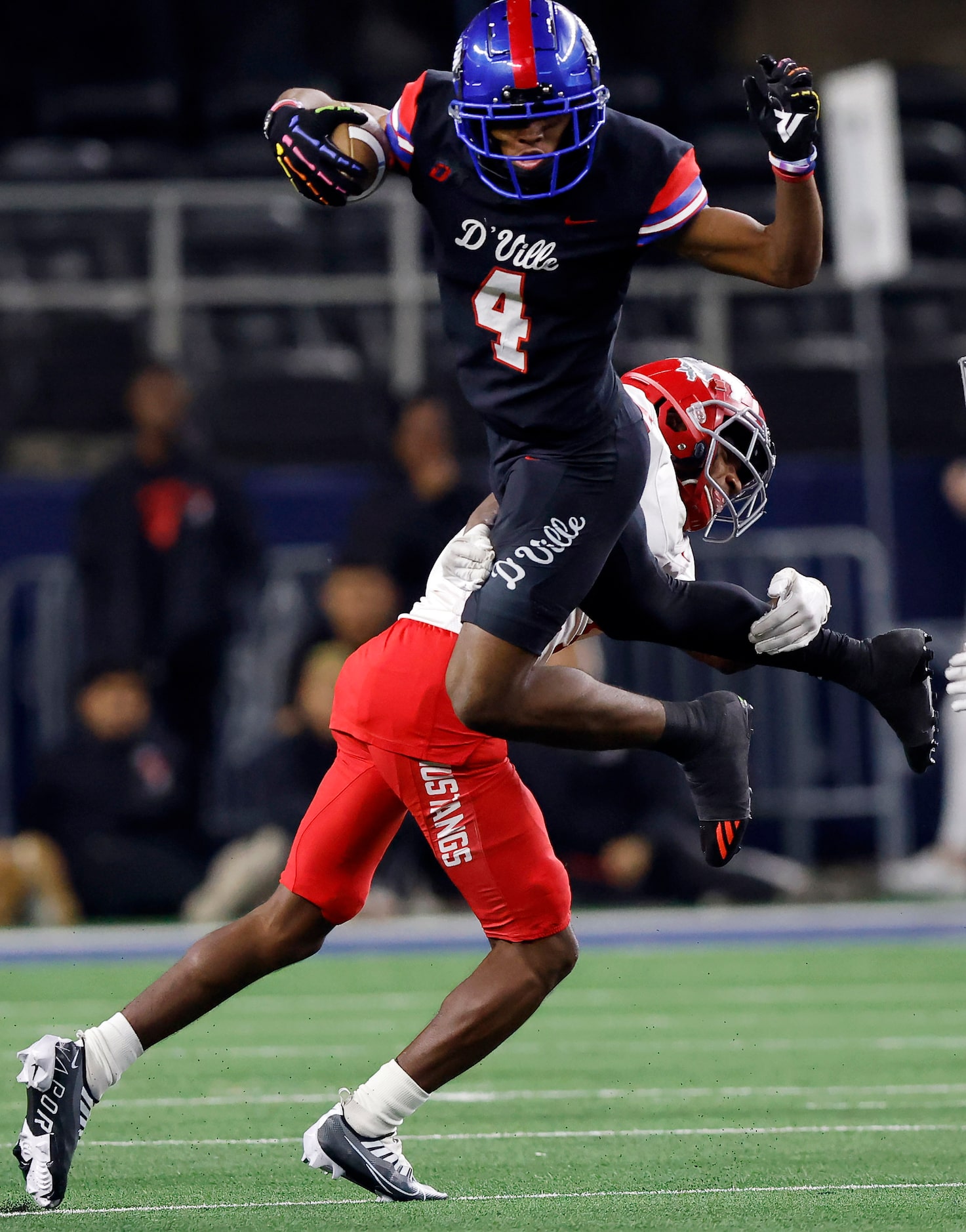 Duncanville wide receiver Dakorian Moore (4) tries to hurdle Galena Park North Shore...