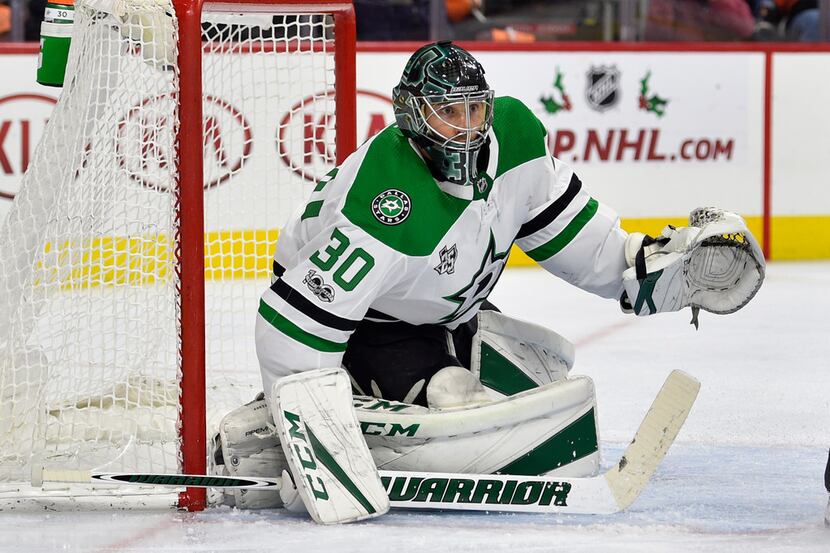 Dallas Stars goalie Ben Bishop looks for a loose puck during the second period of an NHL...
