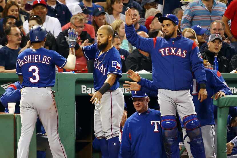 BOSTON, MA - MAY 23: Delino DeShields #3 of the Texas Rangers returns to the dugout after...
