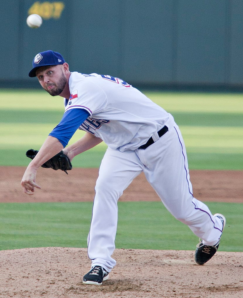 Pitcher Matt Harrison (54) pitches as he continues his comeback from lower lumbar spinal...