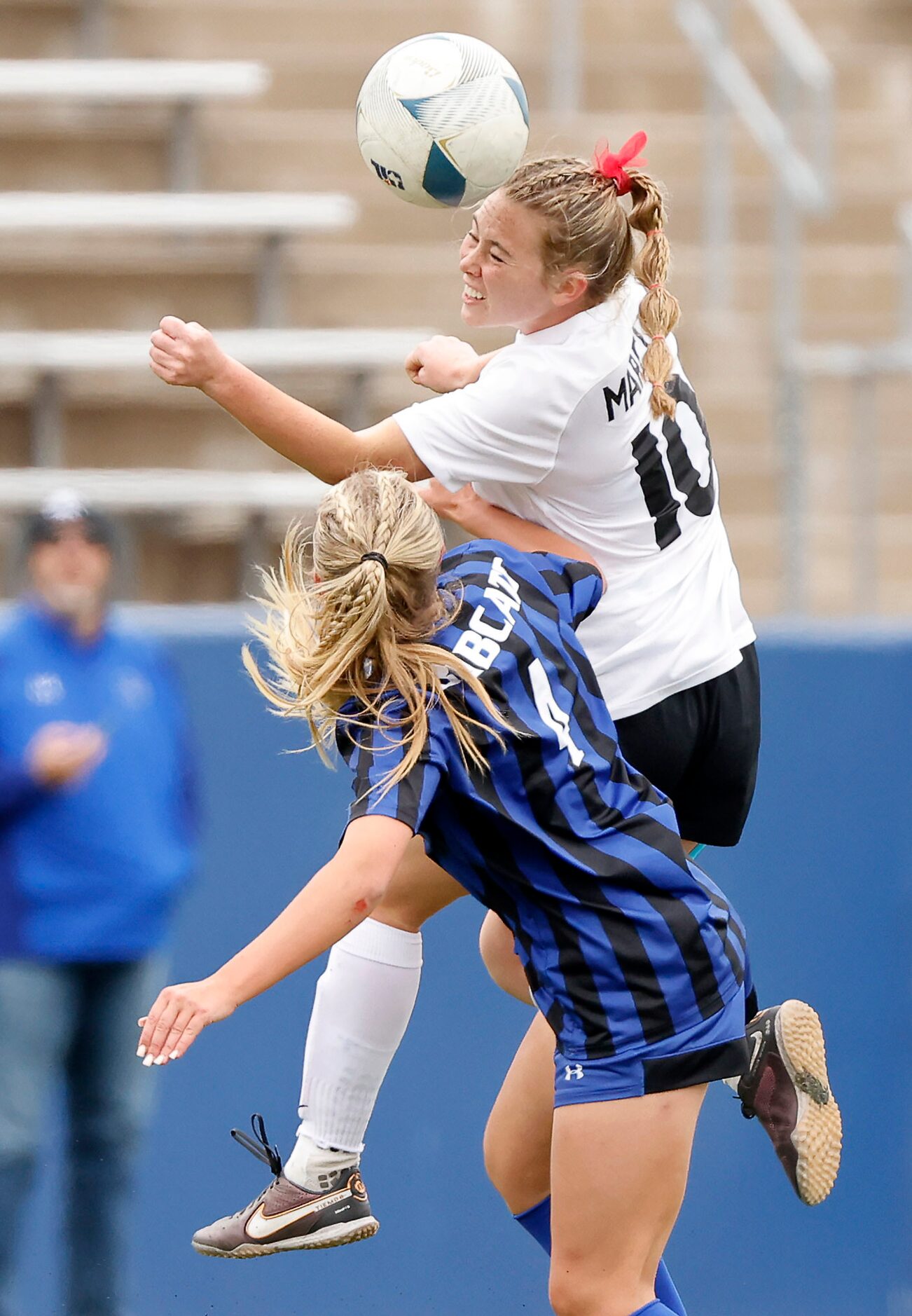 Flower Mound Marcus midfielder Allie Williams (10) heads the ball against Trophy Club Byron...