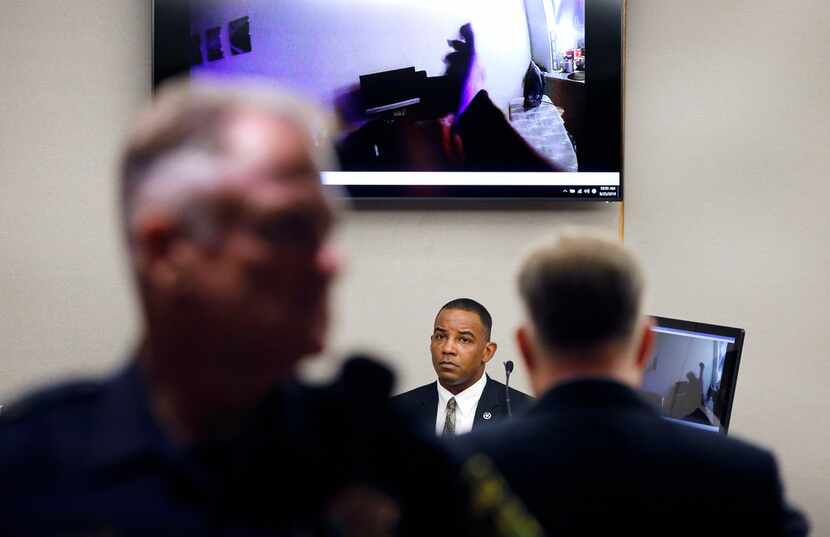 Texas Ranger David Armstrong (center) listens as body camera footage plays in the courtroom...