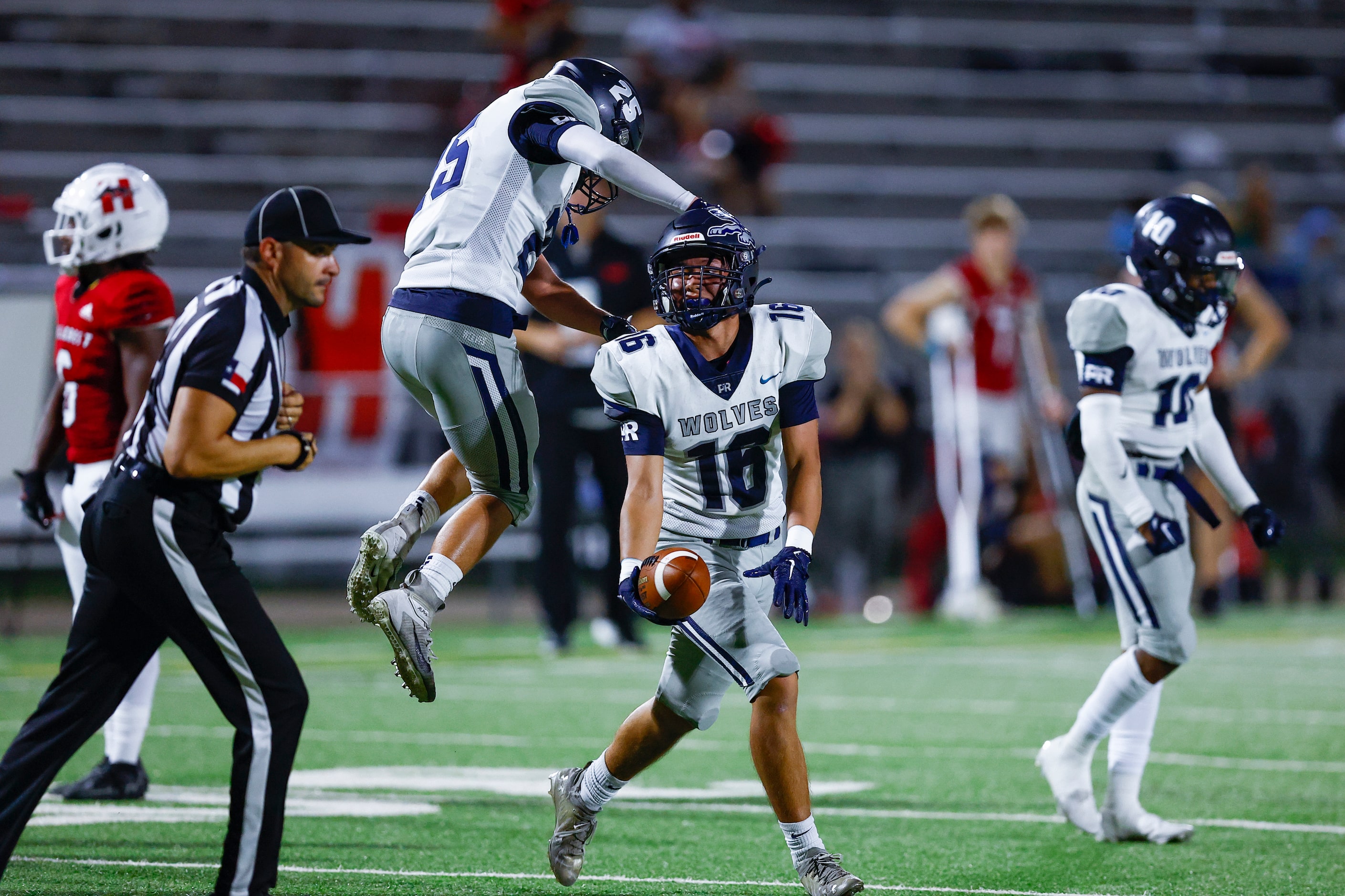 Carrollton Ranchview junior linebacker Haruto Mizuno (16) is congratulated by junior...