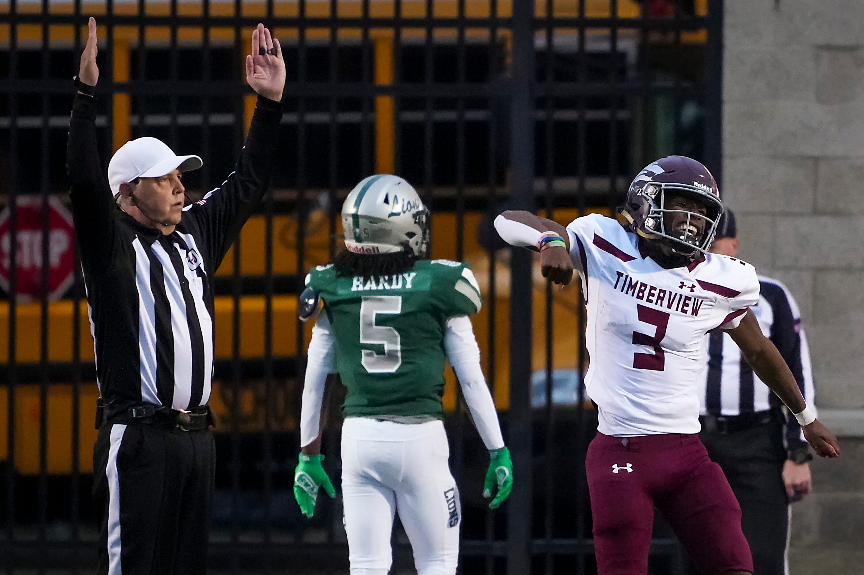 Mansfield Timberview quarterback Cameron Bates (3) celebrates a touchdown by running back...