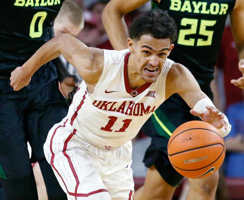 Oklahoma guard Trae Young (11) heads up the court with a steal against Baylor during the...