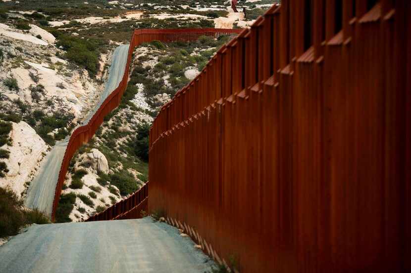 A section of the U.S.-Mexico border fence in Tecate, Calif. (Jim Watson/Agence France-Presse)