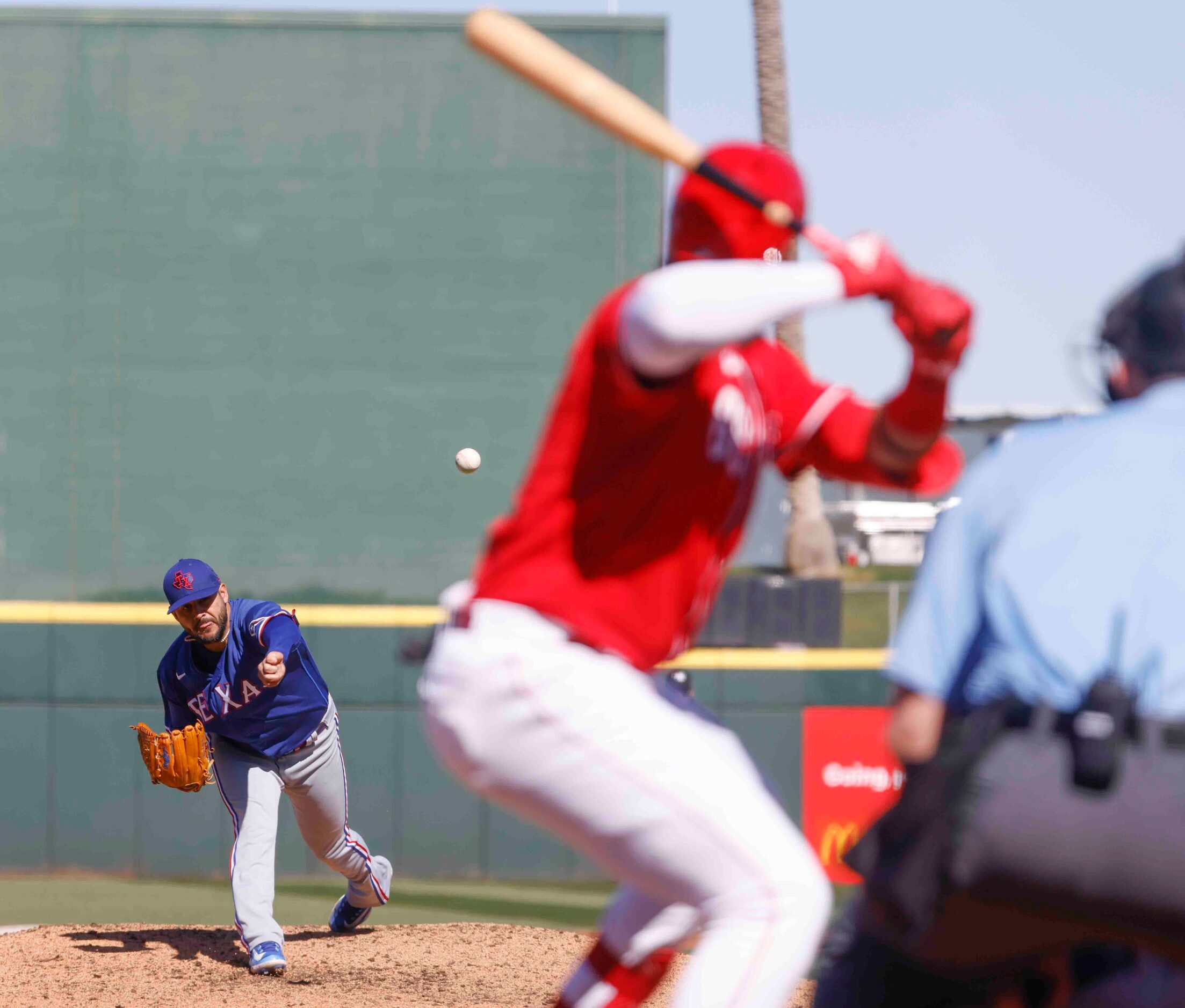 Texas Rangers Martín Pérez delivers a pitch during the second inning of a spring training...