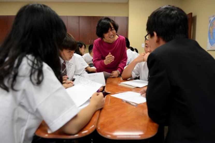 
Chinese language teacher May Shen talks to Chinese exchange students during a lesson at the...