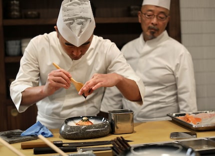 Chef Jimmy Park, left, and executive chef Shinichiro Kondo prepare sushi at Shoyo. The...