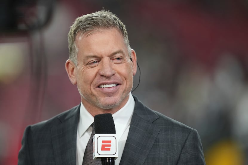 Former Dallas Cowboys quarterback Troy Aikman records a show on the sidelines before an NFL...