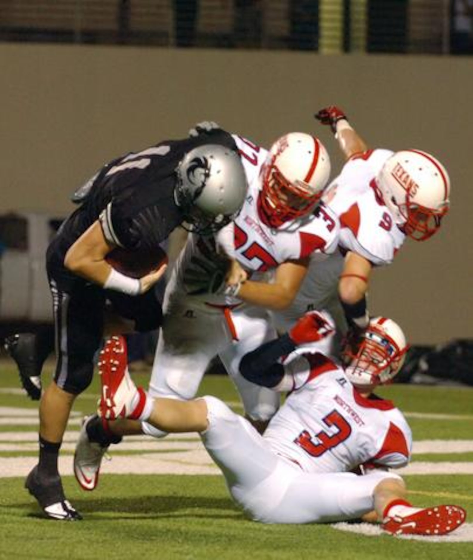 Guyer senior quarterback Colton Berry (11) scores two-point conversion on a trick play as...