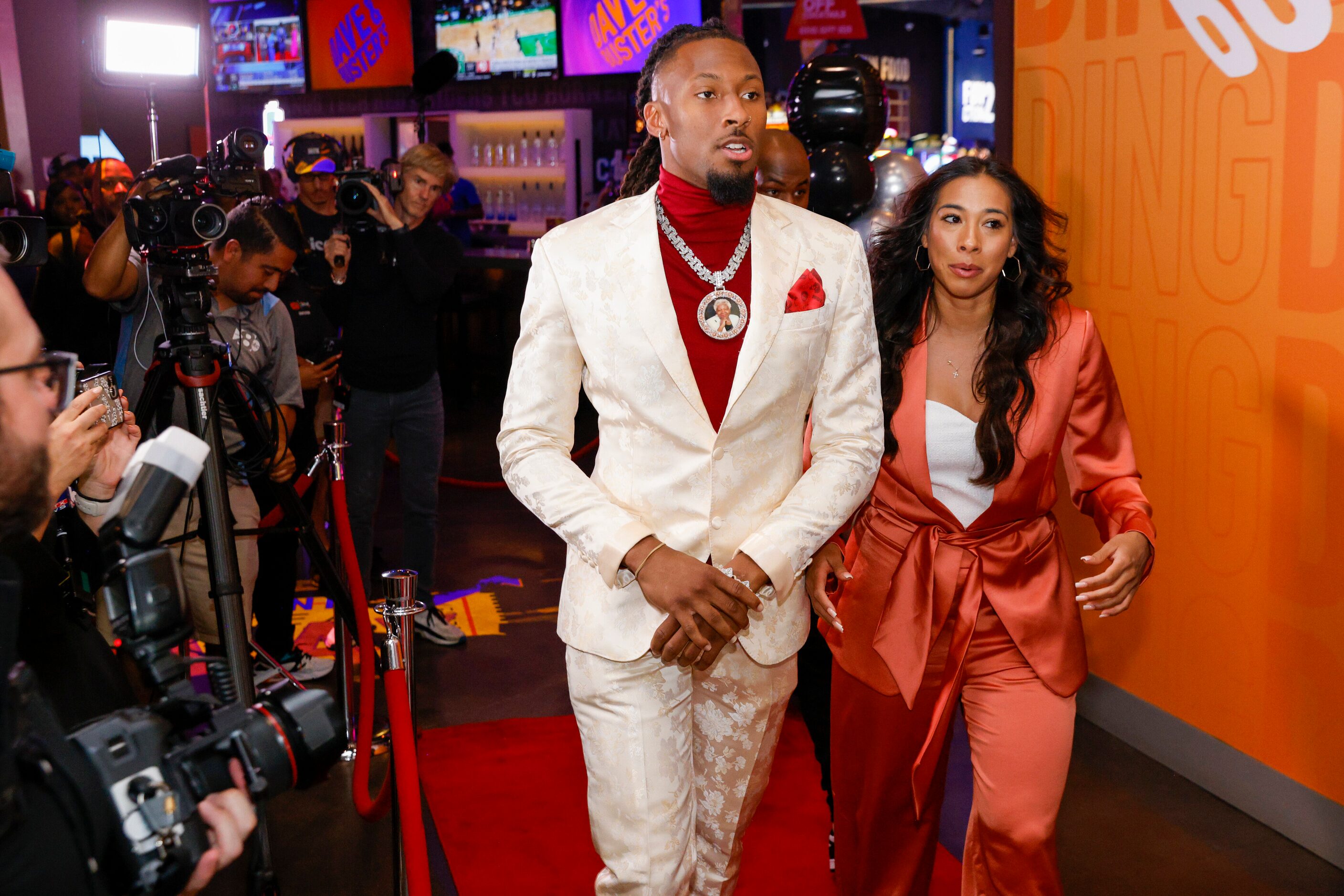 TCU wide receiver Quentin Johnston (left) arrives on the red carpet with his agent Alexis...