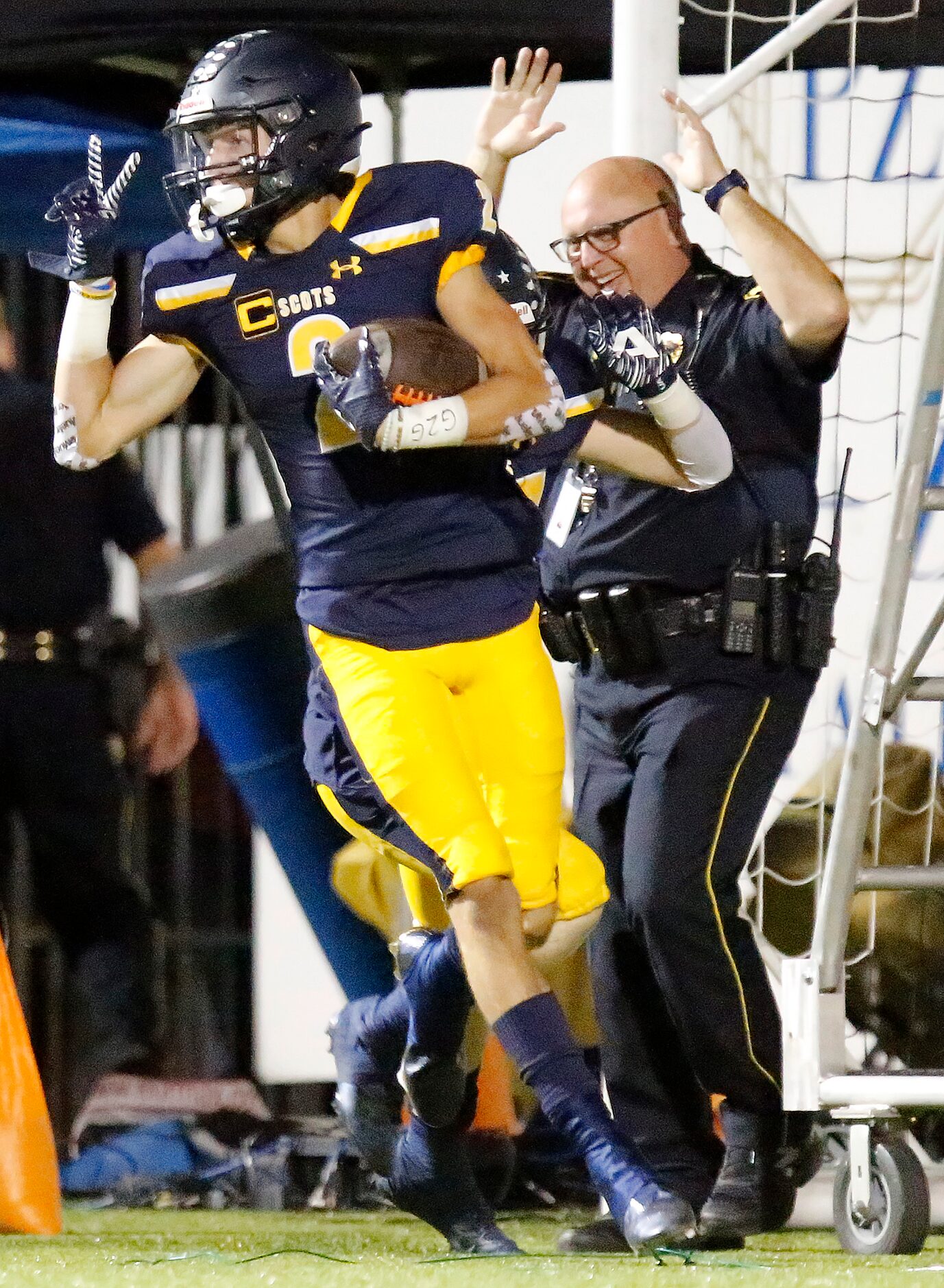 Highland Park High School wide receiver John Rutledge (2) jubilates after returning a...