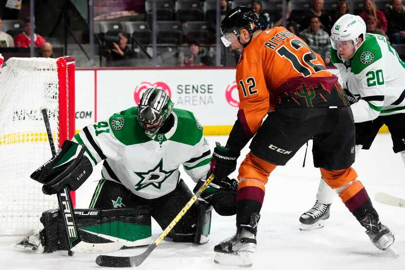Dallas Stars goaltender Scott Wedgewood (41) makes a save on a shot by Arizona Coyotes left...