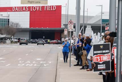 Southwest Airlines flight attendants picketing at the Dallas Love Field Airport in Dallas on...