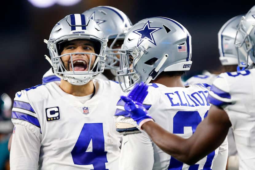 Dallas Cowboys quarterback Dak Prescott (4) keeps his team fired up in the huddle during the...