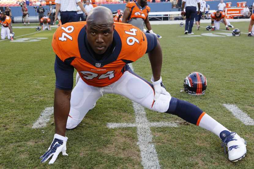 Denver Broncos defensive end DeMarcus Ware stretches prior to an NFL preseason football...