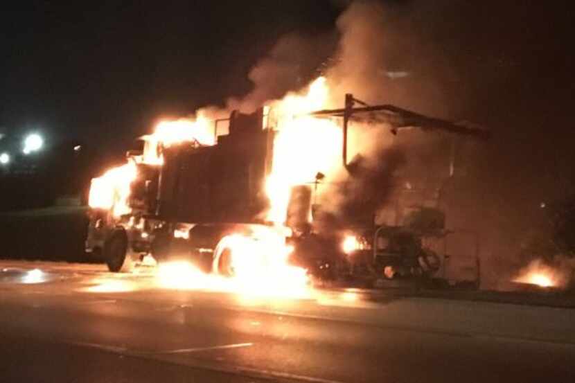 Construction equipment blazes on Loop 820 in Fort Worth on Tuesday morning.