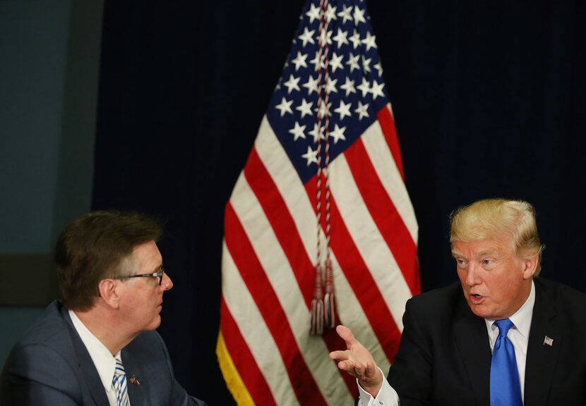 President Donald Trump speaks to Texas Lt. Gov. Dan Patrick during a hurricane response...