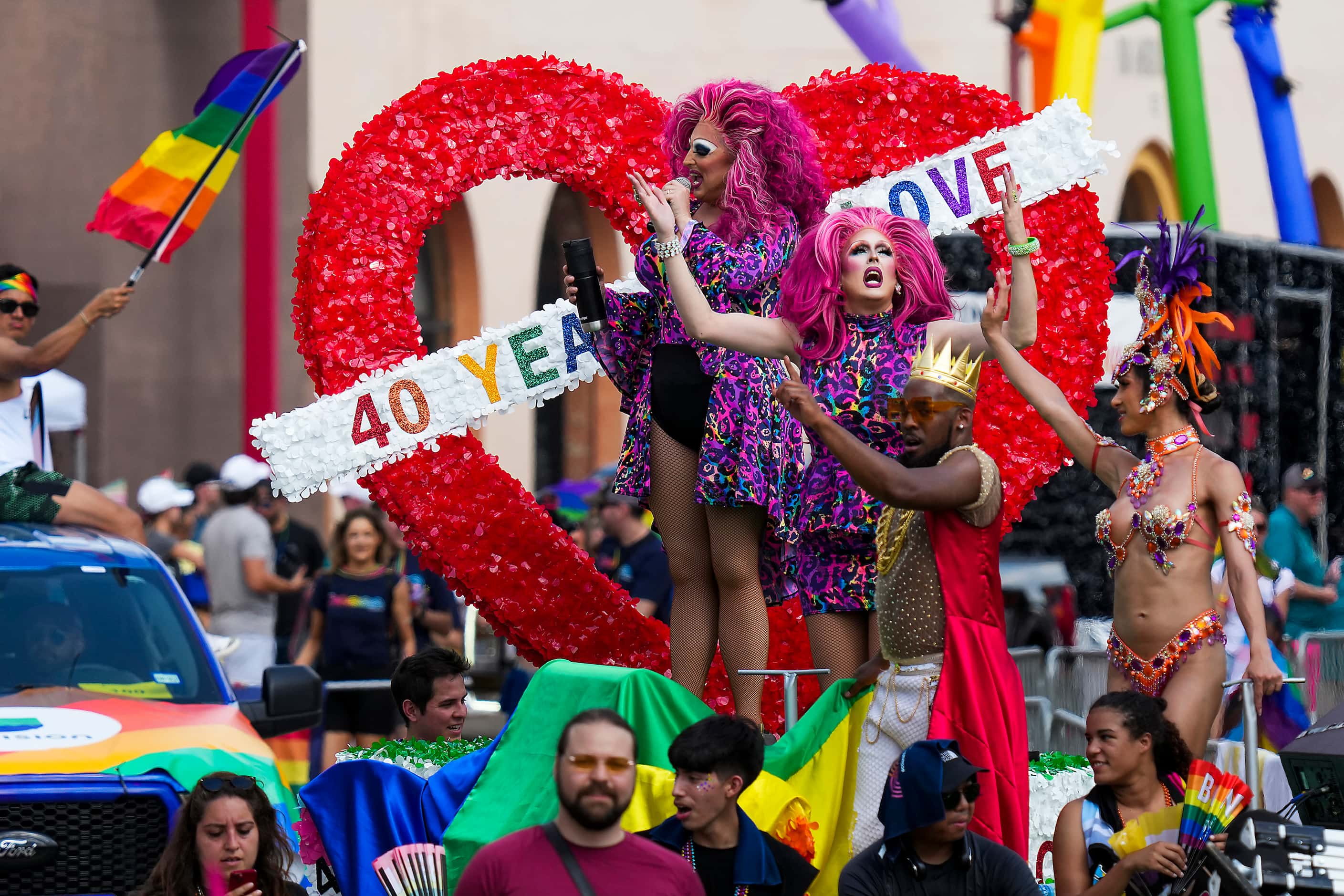 Performers entertain from a float during the annual Alan Ross Texas Freedom Parade...