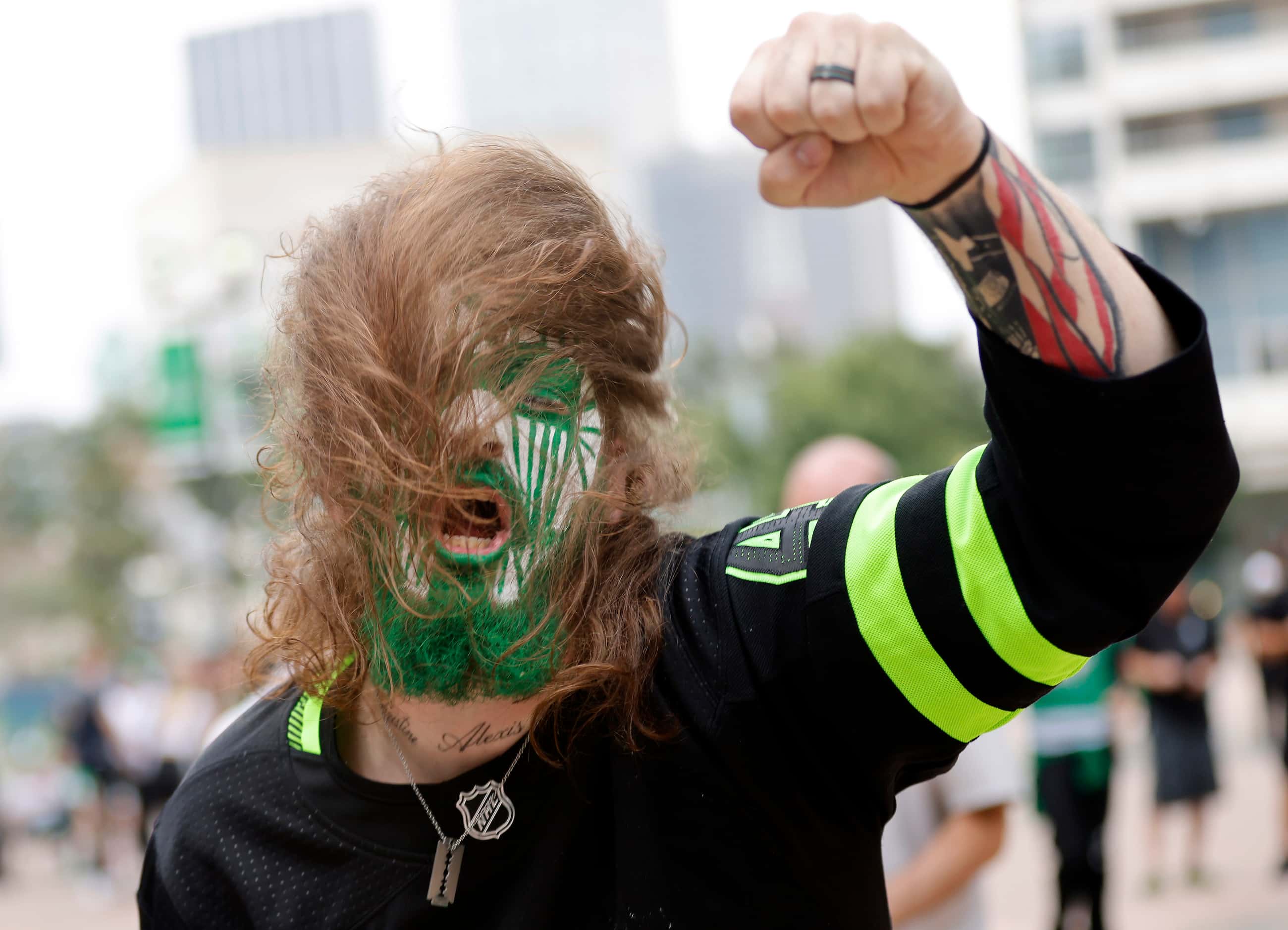Dallas Stars fan JT Sykes of Barry, Texas jams to the music on the plaza before Game 6 of...